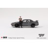 Mini GT Nissan Skyline Gt-R (R32) Nismo RHD con figura de Tsugio Matsuda Gunmetal Grey Escala 1/64 MGT00869rhd